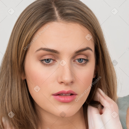 Neutral white young-adult female with long  brown hair and brown eyes