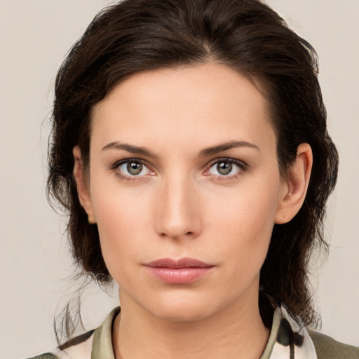 Neutral white young-adult female with medium  brown hair and brown eyes