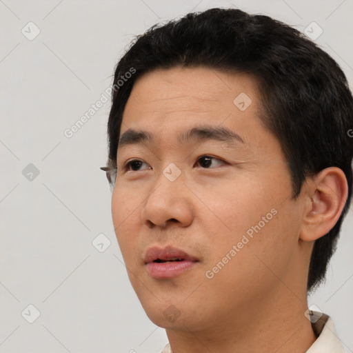 Neutral asian young-adult male with short  black hair and brown eyes