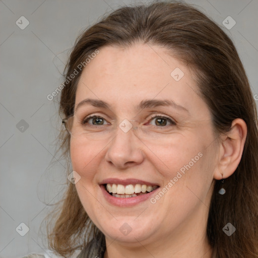 Joyful white adult female with medium  brown hair and brown eyes