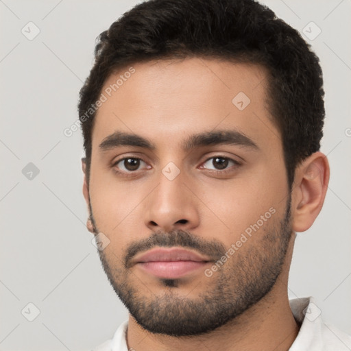 Neutral latino young-adult male with short  black hair and brown eyes