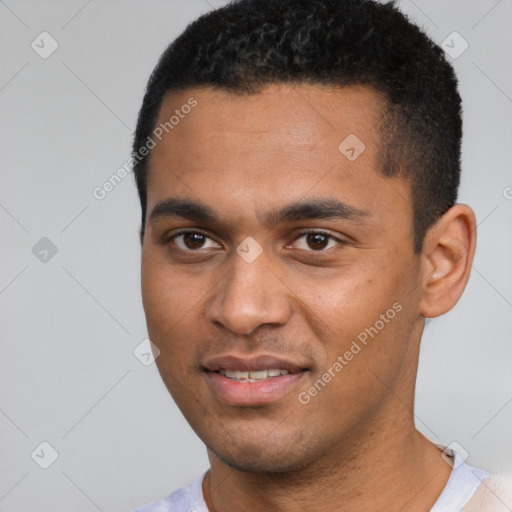 Joyful black young-adult male with short  black hair and brown eyes