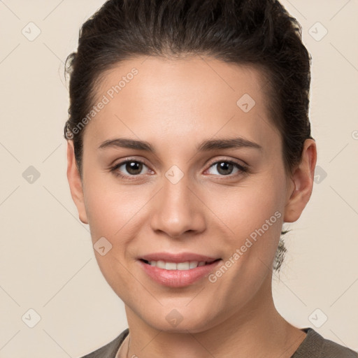 Joyful white young-adult female with short  brown hair and brown eyes