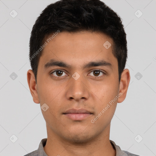 Neutral latino young-adult male with short  brown hair and brown eyes