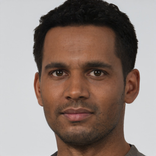 Neutral black young-adult male with short  black hair and brown eyes