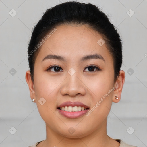 Joyful asian young-adult female with short  brown hair and brown eyes