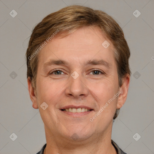 Joyful white adult male with short  brown hair and brown eyes