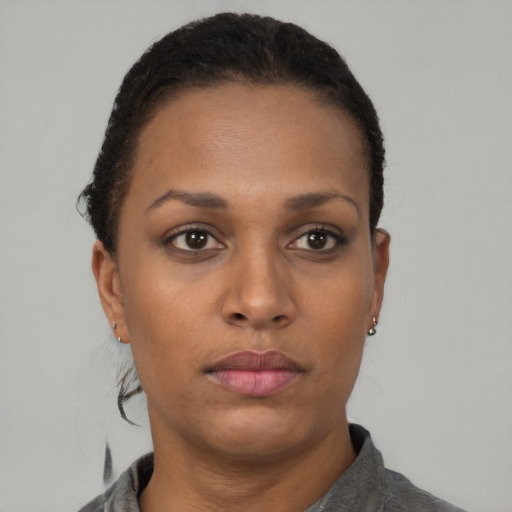 Neutral black young-adult female with short  brown hair and brown eyes