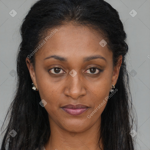 Joyful black young-adult female with long  brown hair and brown eyes