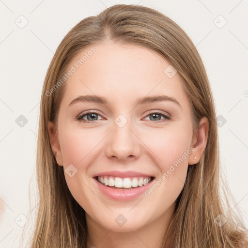 Joyful white young-adult female with long  brown hair and green eyes