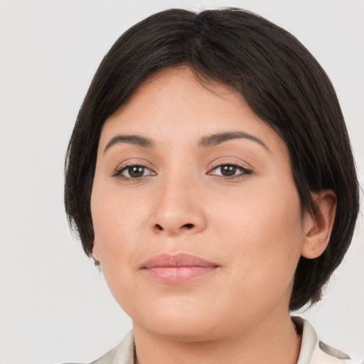 Joyful asian young-adult female with medium  brown hair and brown eyes
