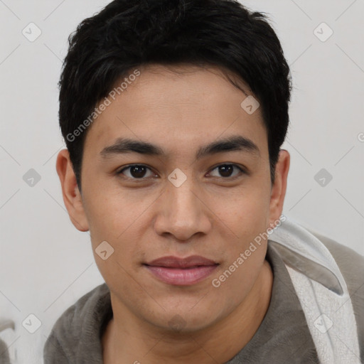 Joyful asian young-adult male with short  black hair and brown eyes