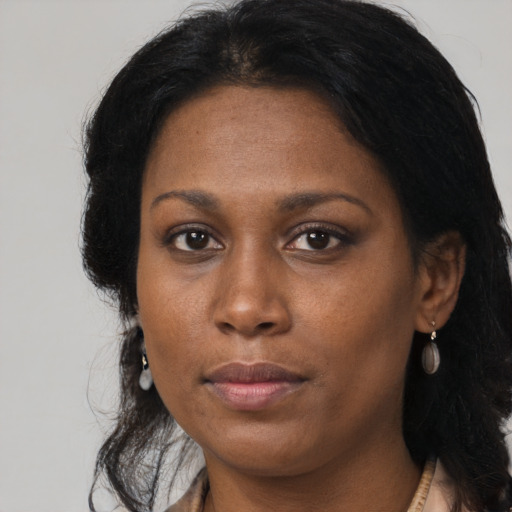Neutral black adult female with medium  brown hair and brown eyes