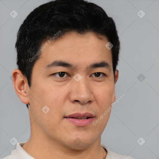 Joyful white young-adult male with short  black hair and brown eyes