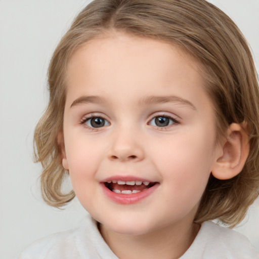 Joyful white child female with medium  brown hair and brown eyes