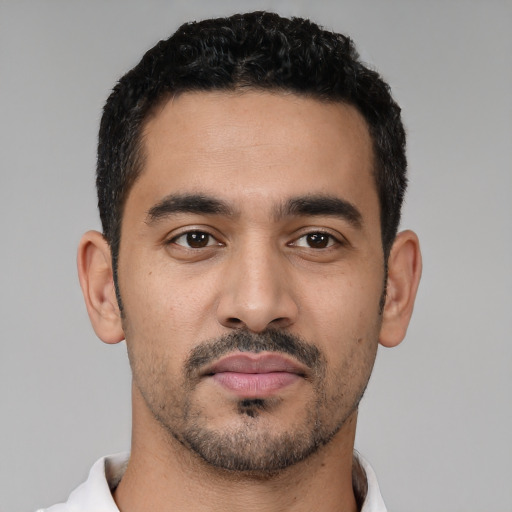 Neutral latino young-adult male with short  black hair and brown eyes