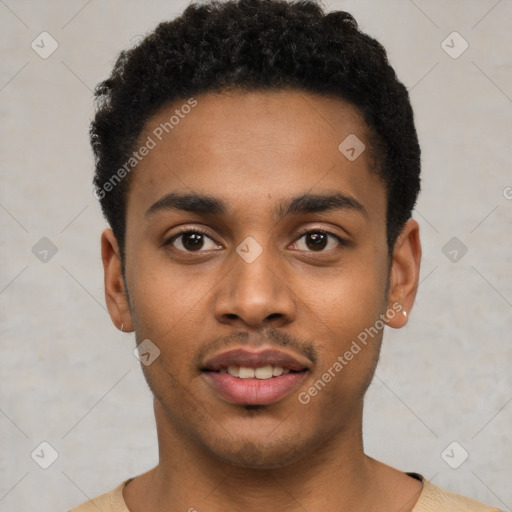 Joyful black young-adult male with short  black hair and brown eyes