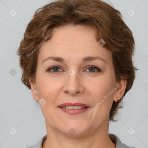 Joyful white adult female with short  brown hair and brown eyes