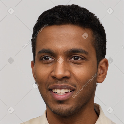 Joyful black young-adult male with short  black hair and brown eyes