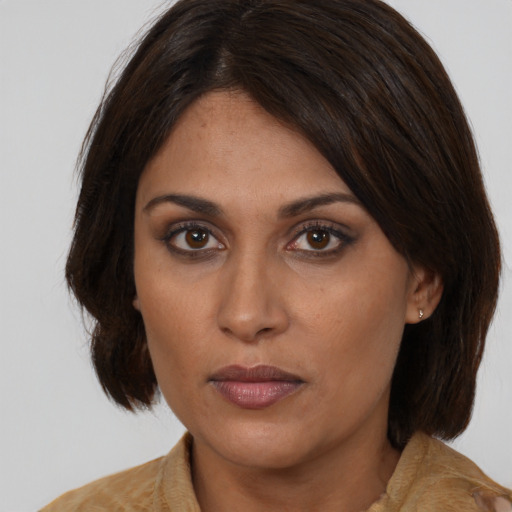 Neutral latino young-adult female with medium  brown hair and brown eyes