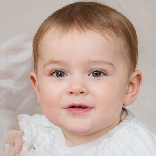 Joyful white child male with short  brown hair and blue eyes