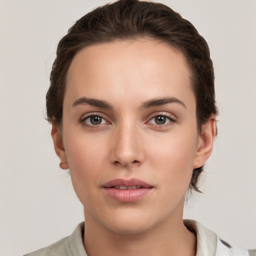 Neutral white young-adult female with short  brown hair and brown eyes