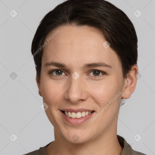 Joyful white young-adult female with short  brown hair and brown eyes