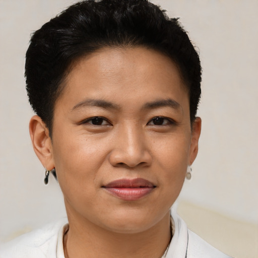 Joyful asian young-adult female with short  brown hair and brown eyes