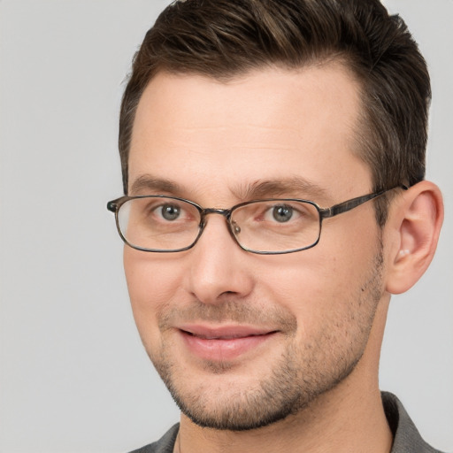 Joyful white adult male with short  brown hair and brown eyes