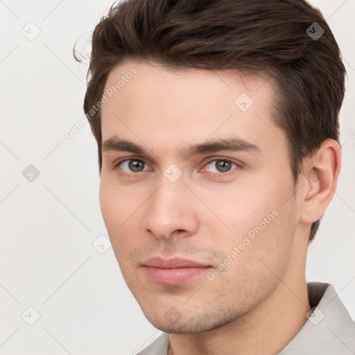 Neutral white young-adult male with short  brown hair and brown eyes