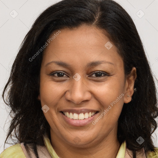 Joyful latino young-adult female with long  brown hair and brown eyes