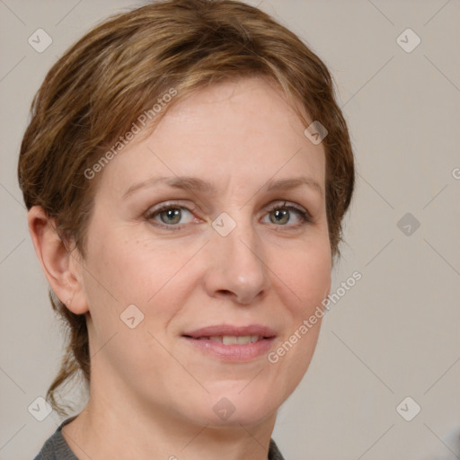 Joyful white adult female with short  brown hair and grey eyes