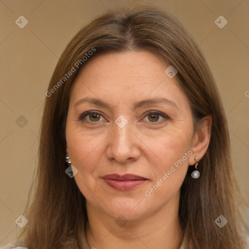 Joyful white adult female with long  brown hair and grey eyes