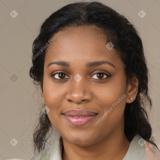 Joyful black young-adult female with medium  brown hair and brown eyes