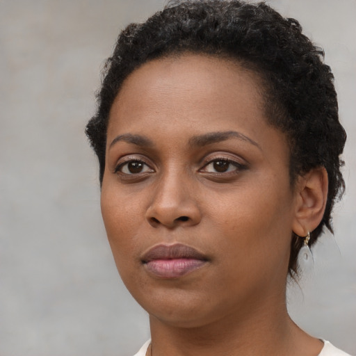Neutral black young-adult female with short  black hair and brown eyes