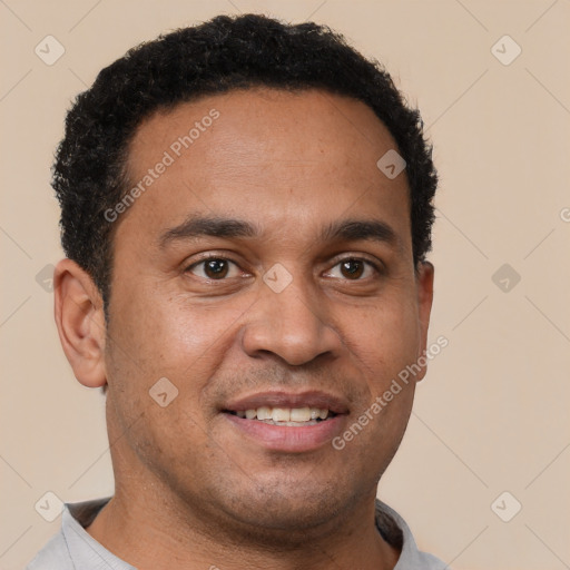 Joyful latino young-adult male with short  brown hair and brown eyes