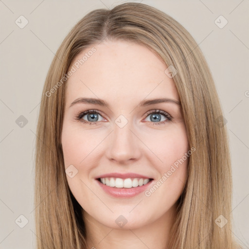 Joyful white young-adult female with long  brown hair and green eyes