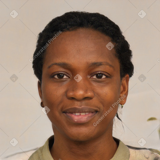 Joyful black young-adult female with short  black hair and brown eyes