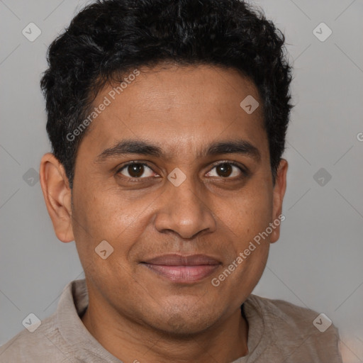 Joyful latino young-adult male with short  brown hair and brown eyes