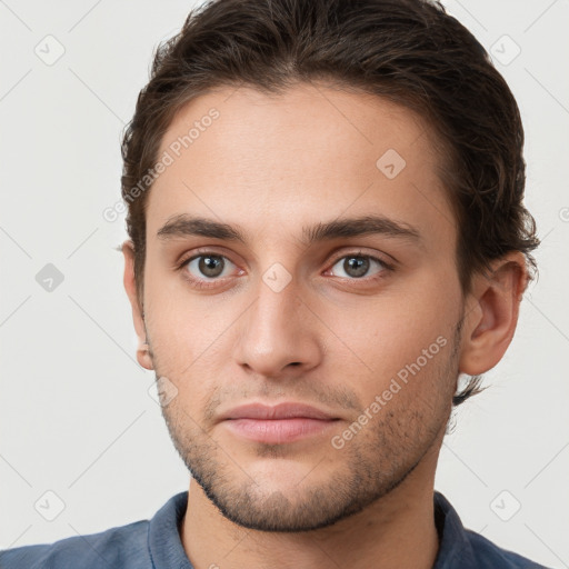 Neutral white young-adult male with short  brown hair and brown eyes