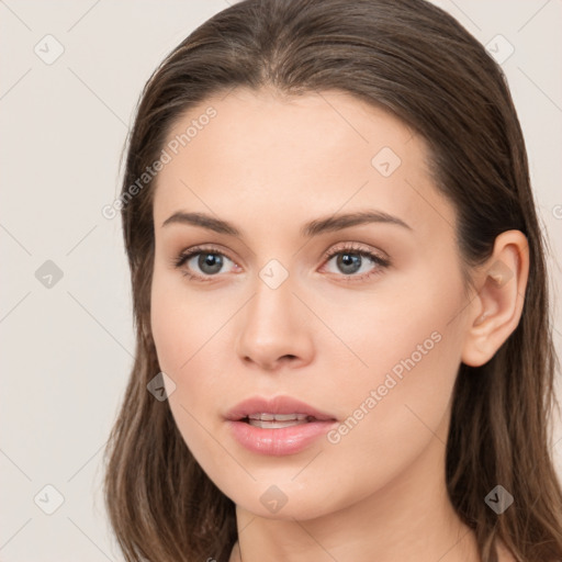 Neutral white young-adult female with long  brown hair and brown eyes