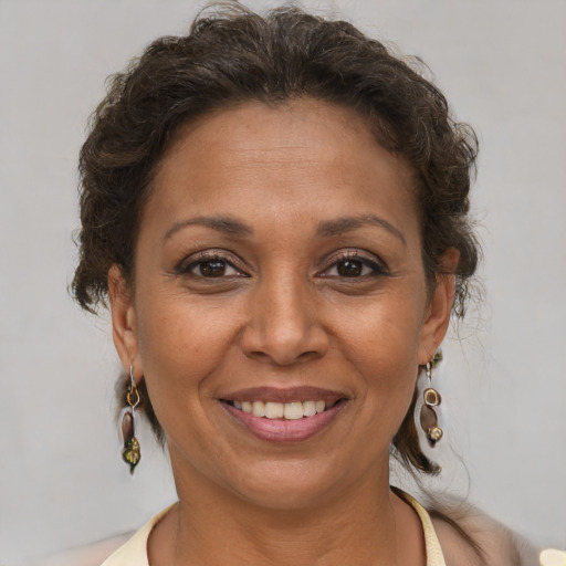 Joyful white adult female with short  brown hair and brown eyes