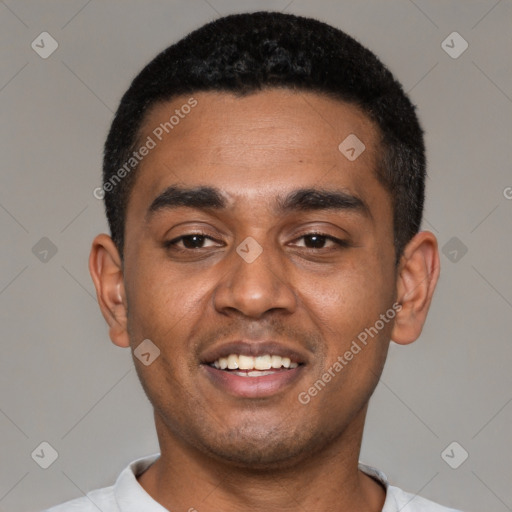 Joyful black young-adult male with short  black hair and brown eyes