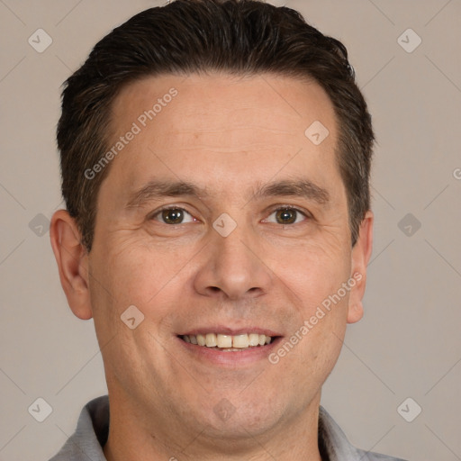 Joyful white adult male with short  brown hair and brown eyes