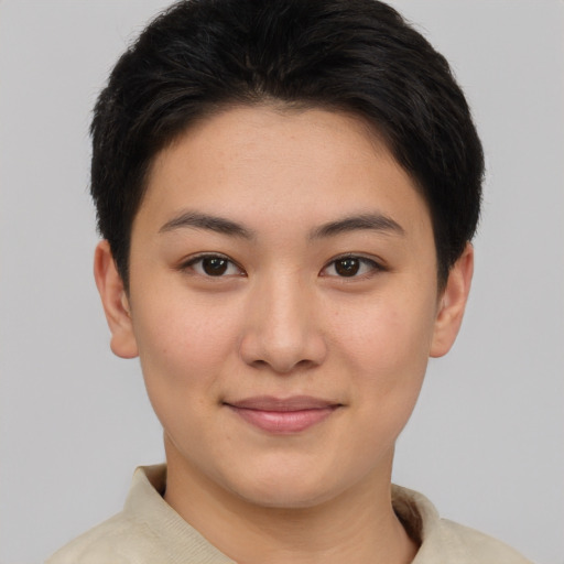 Joyful asian young-adult female with short  brown hair and brown eyes