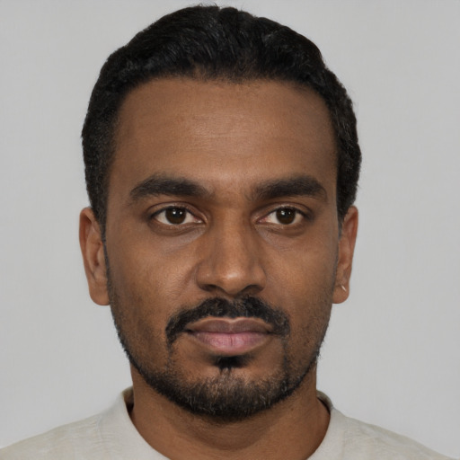 Neutral black young-adult male with short  black hair and brown eyes
