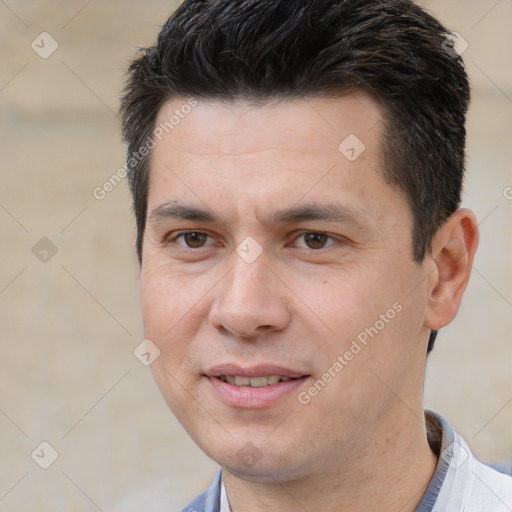 Joyful white adult male with short  brown hair and brown eyes