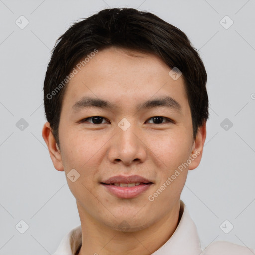 Joyful asian young-adult male with short  brown hair and brown eyes