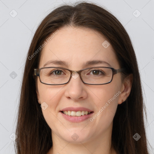 Joyful white young-adult female with long  brown hair and grey eyes