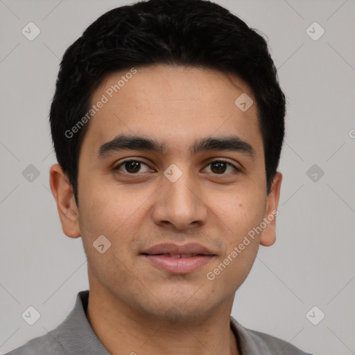 Joyful white young-adult male with short  black hair and brown eyes